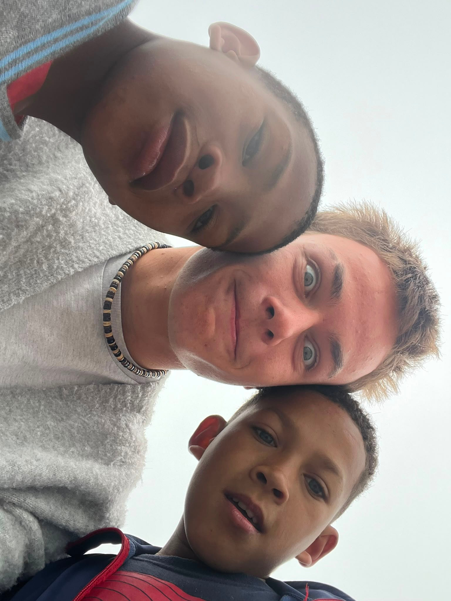 A close-up selfie of three friends